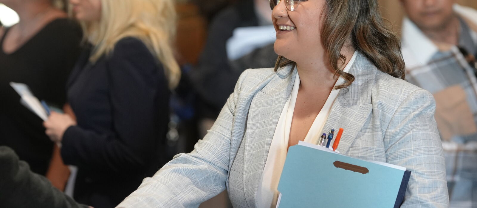 A job seeker greets an employer at an INCIGHT job fair.
